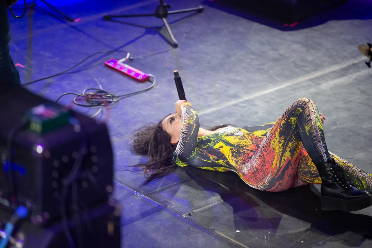 Lead Singer of The Sintrics performs on stage in custom Pour Hippy Drip stagewear